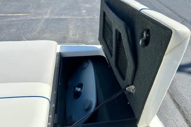 Slide: The Image of Open storage compartment in a 2003 Malibu Wakesetter VLX boat. - 9