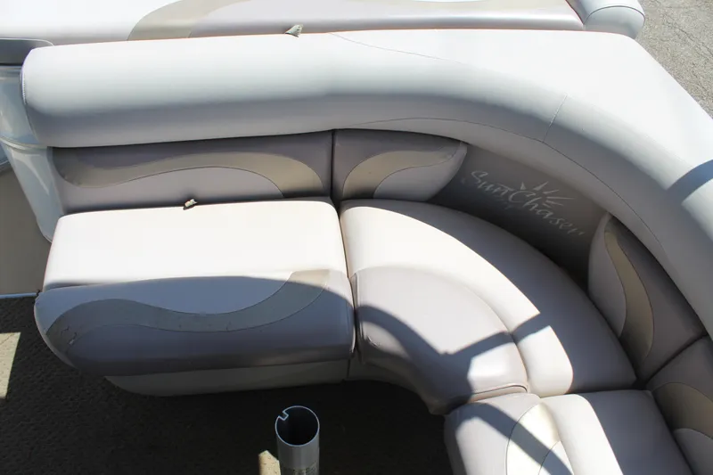 Slide: The Image of 2013 SunChaser 8520 Cruise boat seating with light gray upholstery and curved design. - 14