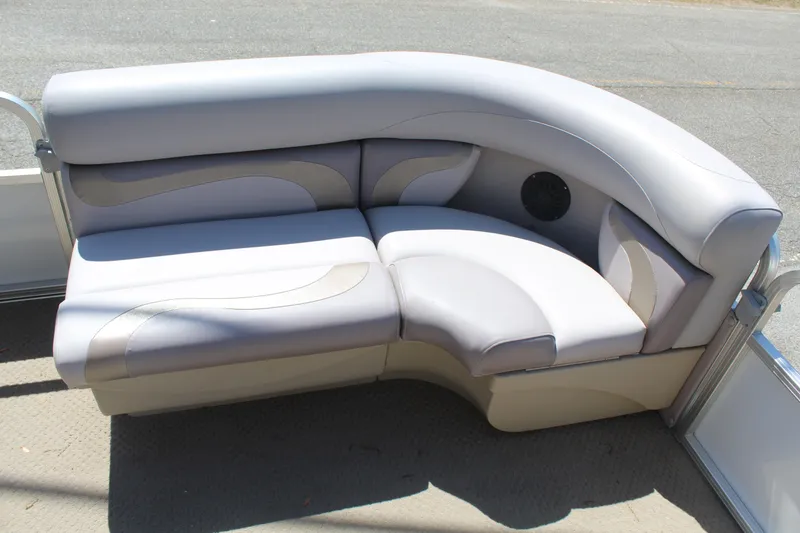 Slide: The Image of 2013 SunChaser 8520 Cruise boat interior with curved seating and speaker. - 16