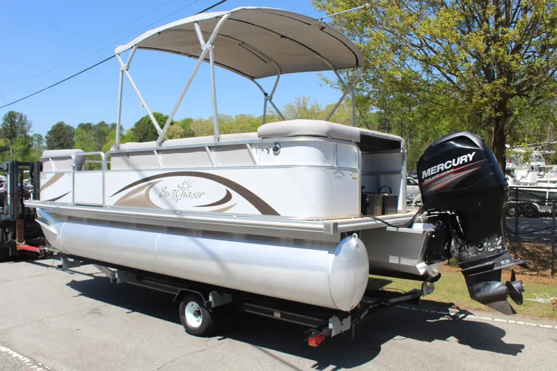 Slide: The Image of 2013 SunChaser 8520 Cruise pontoon boat with Mercury outboard motor on trailer. - 3