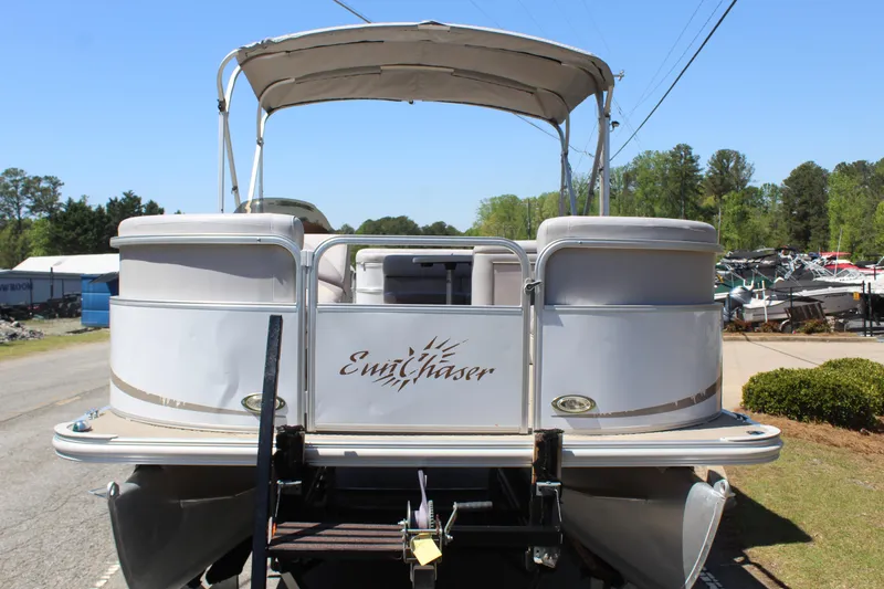 Slide: The Image of 2013 SunChaser 8520 Cruise pontoon boat on trailer, parked outdoors. - 4