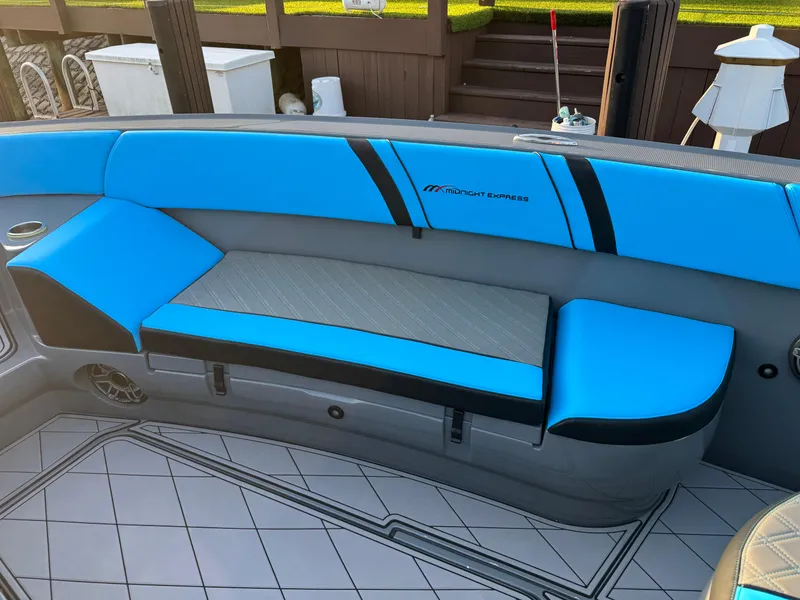 Slide: The Image of Blue and gray seating on 2021 Midnight Express 37 Open boat deck. - 10