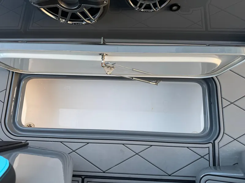 Slide: The Image of Open storage compartment on a 2021 Midnight Express 37 Open boat deck. - 18