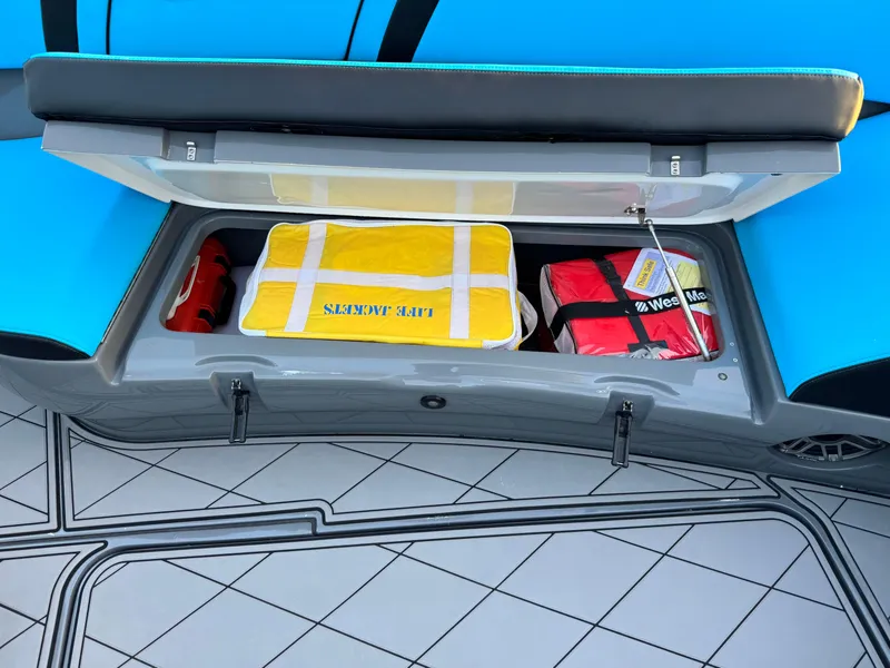 Slide: The Image of Storage compartment on 2021 Midnight Express 37 Open boat with life jackets and safety gear. - 20