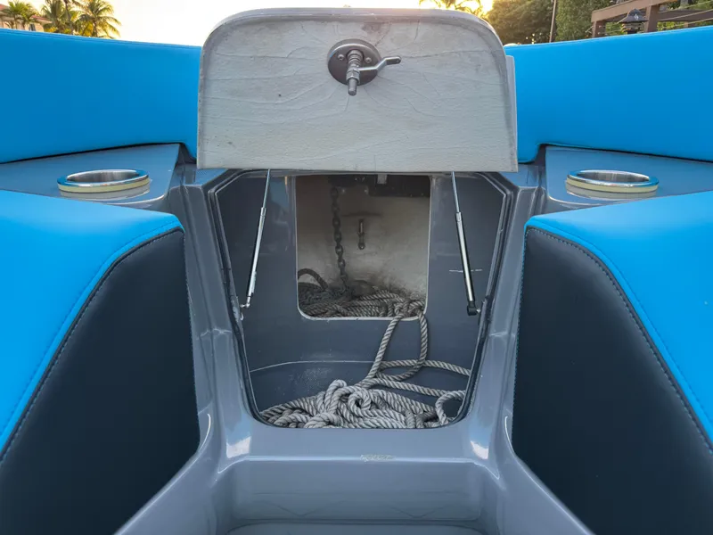 Slide: The Image of 2021 Midnight Express 37 Open boat anchor storage with blue and gray interior. - 21