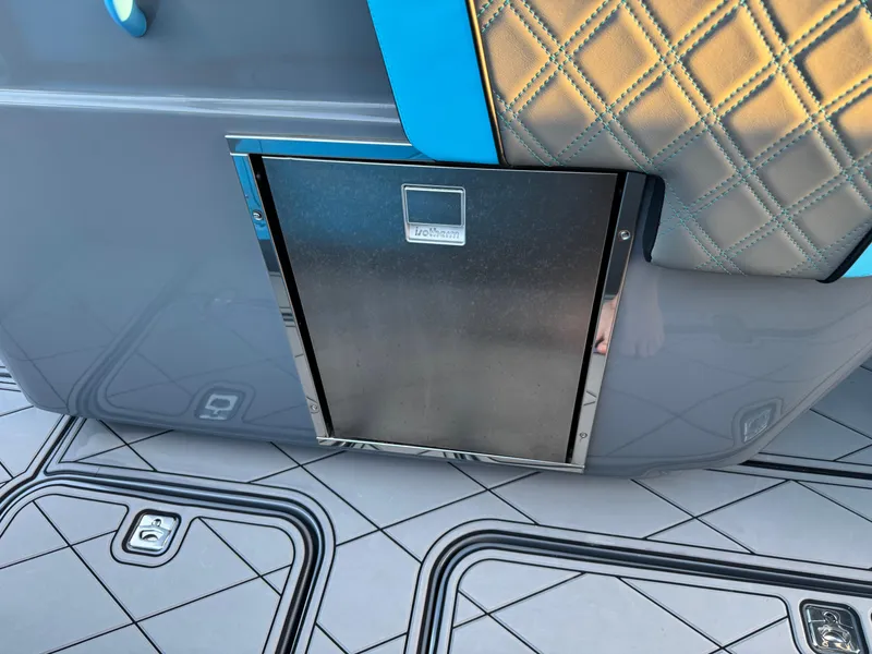 Slide: The Image of 2021 Midnight Express 37 Open boat interior with quilted upholstery and stainless steel compartment. - 24