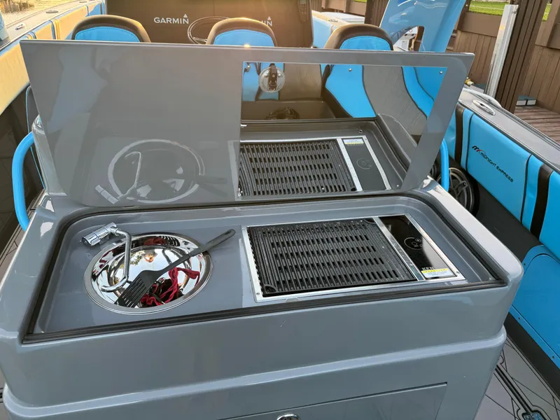 Slide: The Image of 2021 Midnight Express 37 Open boat with modern grill and sink setup. - 25