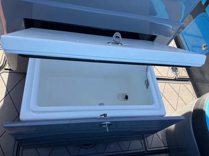 Slide: The Image of Open storage compartment on 2021 Midnight Express 37 Open boat. - 26