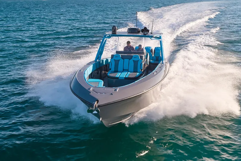 Slide: The Image of 2021 Midnight Express 37 Open boat cruising on open water, showcasing sleek design and speed. - 27