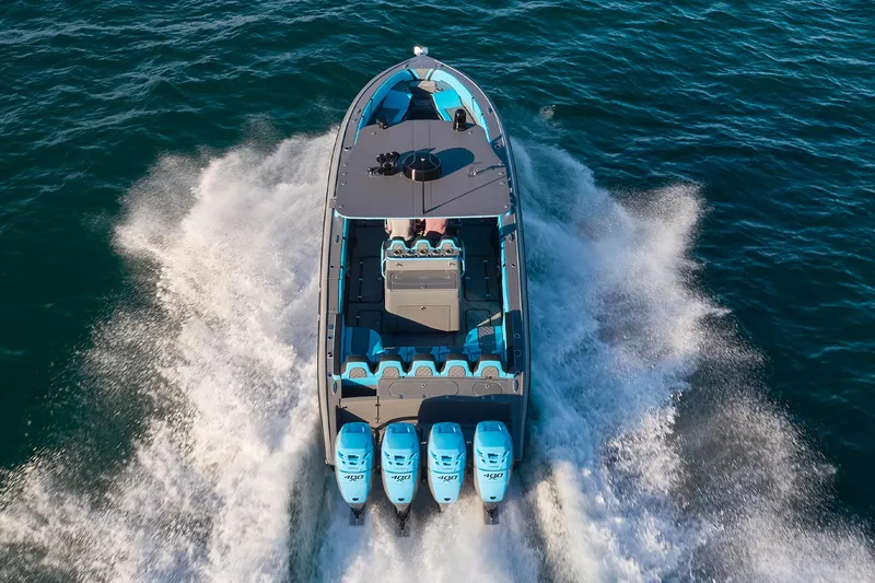 Slide: The Image of 2021 Midnight Express 37 Open boat cruising on water with four engines. - 28