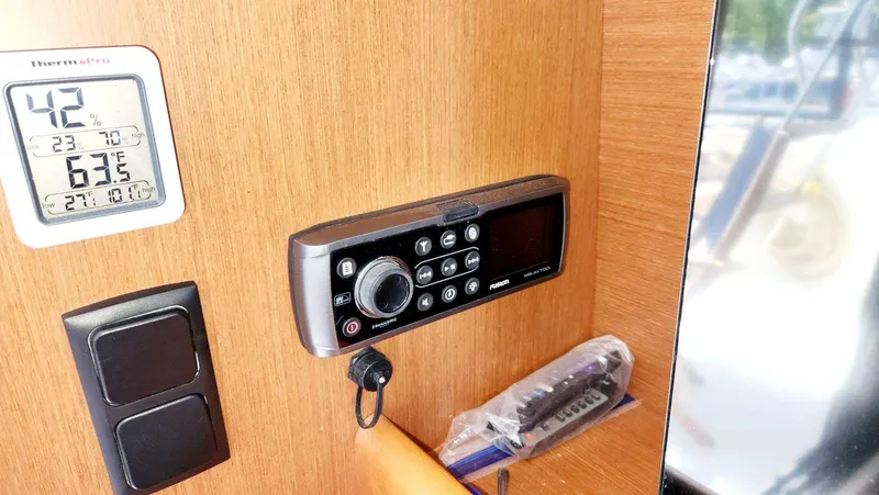 Slide: The Image of ThermoPro hygrometer and Fusion stereo on 2015 Beneteau Swift Trawler 34 interior. - 19