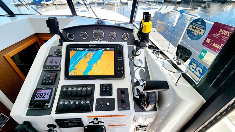 Slide: The Image of Helm of 2015 Beneteau Swift Trawler 34 with navigation equipment and controls. - 30