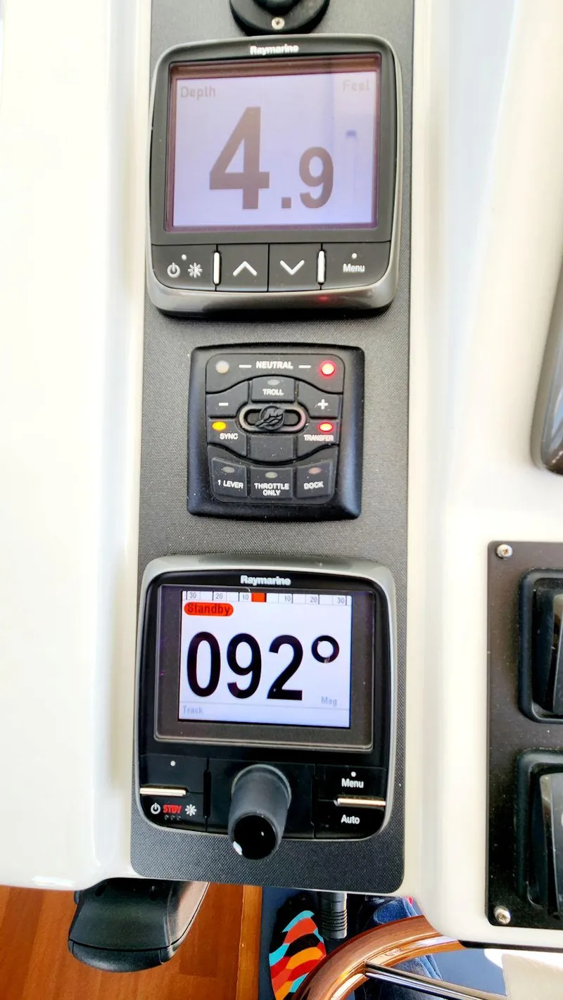 Slide: The Image of Control panel of a 2015 Beneteau Swift Trawler 34, displaying depth and heading. - 31