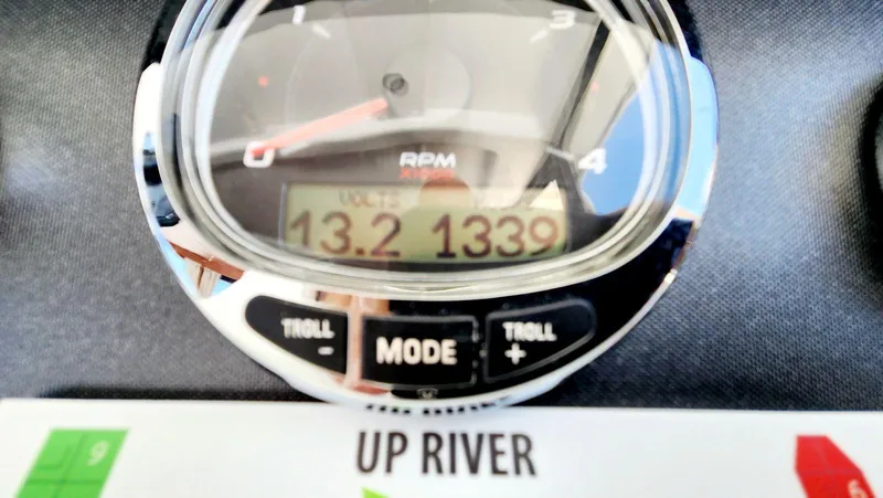 Slide: The Image of Close-up of a Beneteau Swift Trawler 34 gauge showing RPM and voltage readings. - 37