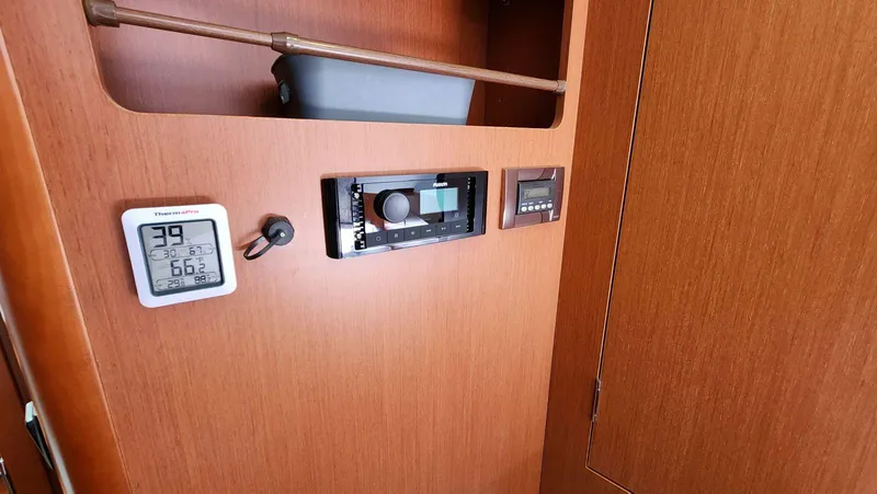 Slide: The Image of Interior of 2015 Beneteau Swift Trawler 34 with control panel and thermometer. - 42