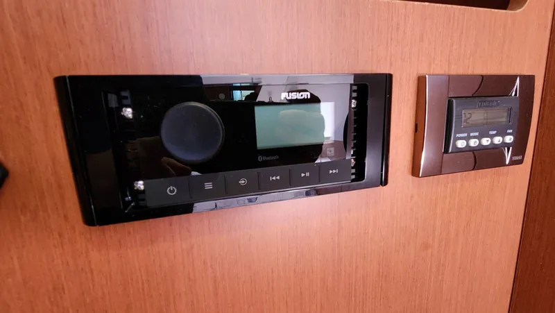 Slide: The Image of Control panel on 2015 Beneteau Swift Trawler 34, featuring Fusion audio system and digital display. - 43