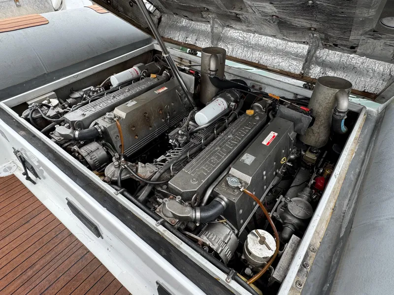Slide: The Image of Twin engines in a 1995 Nautica 33 Commercial RIB boat, showcasing detailed mechanical components. - 12