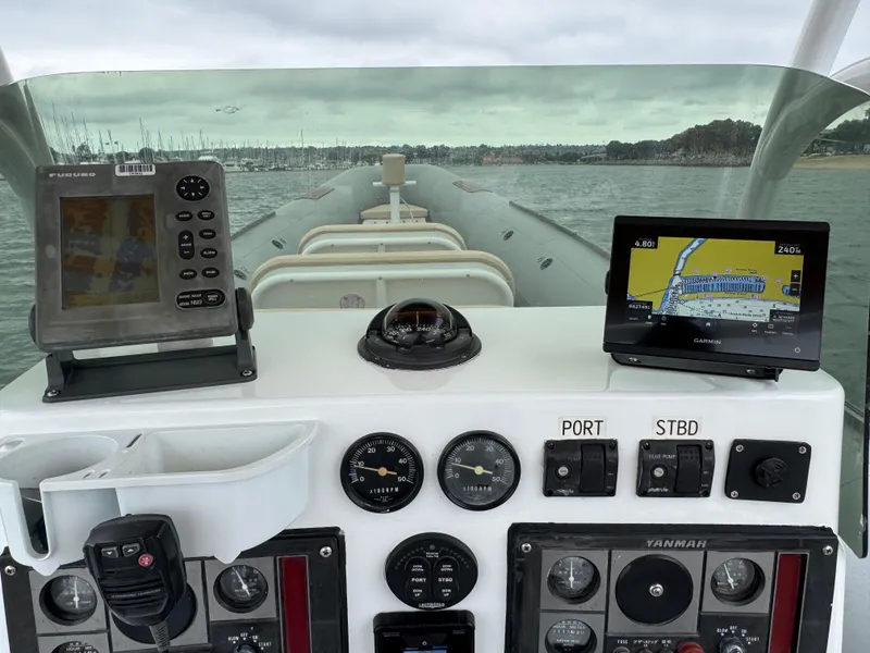 Slide: The Image of Cockpit view of 1995 Nautica 33 Commercial RIB with navigation instruments and controls. - 3
