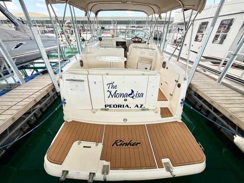 Slide: The Image of 2006 Rinker 270 Express Cruiser docked, featuring teak deck and canopy, Peoria, AZ. - 3