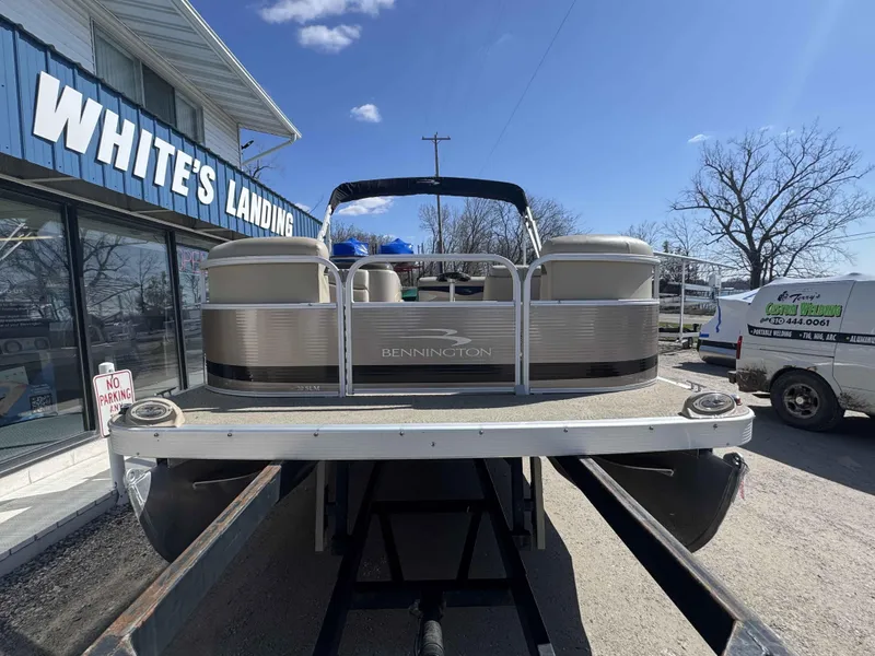 Slide: The Image of 2015 Bennington 20 SL pontoon boat at White's Landing, sunny day. - 2