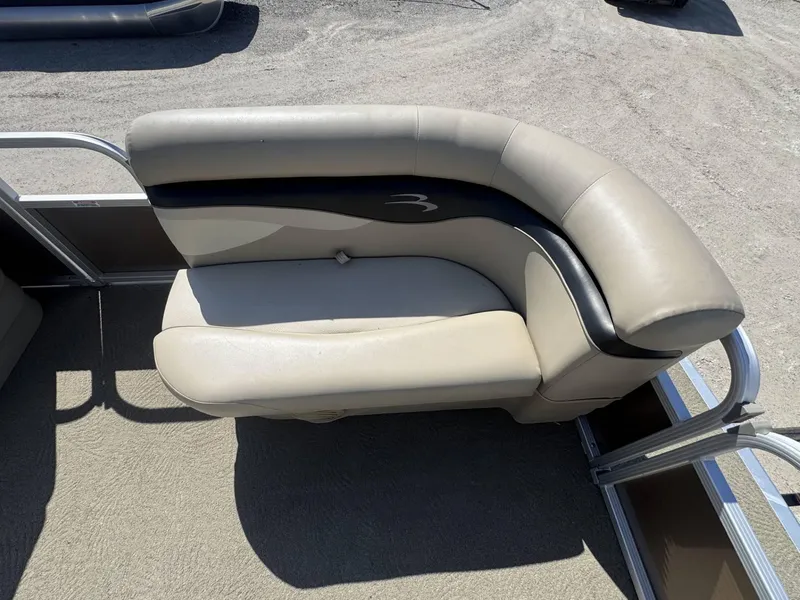 Slide: The Image of 2015 Bennington 20 SL boat seat with beige and black upholstery. - 8