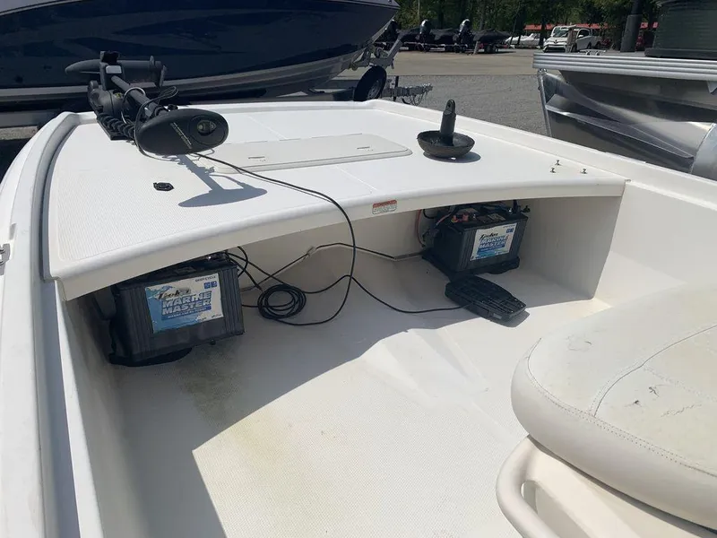 Slide: The Image of 2012 Mako PRO 17 SKIFF boat interior with batteries and trolling motor. - 3