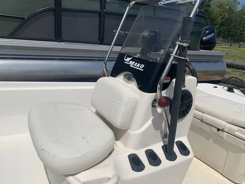 Slide: The Image of 2012 Mako PRO 17 SKIFF boat console with seat and steering wheel. - 4