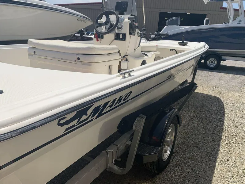 Slide: The Image of 2012 Mako PRO 17 SKIFF boat on trailer, parked outdoors. - 6