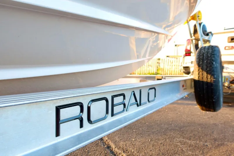 Slide: The Image of 2023 Robalo R200 Center Console boat on trailer, close-up view. - 4