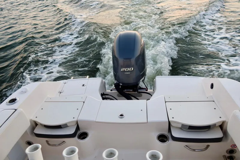Slide: The Image of 2023 Robalo R200 Center Console boat with outboard motor on water. - 8