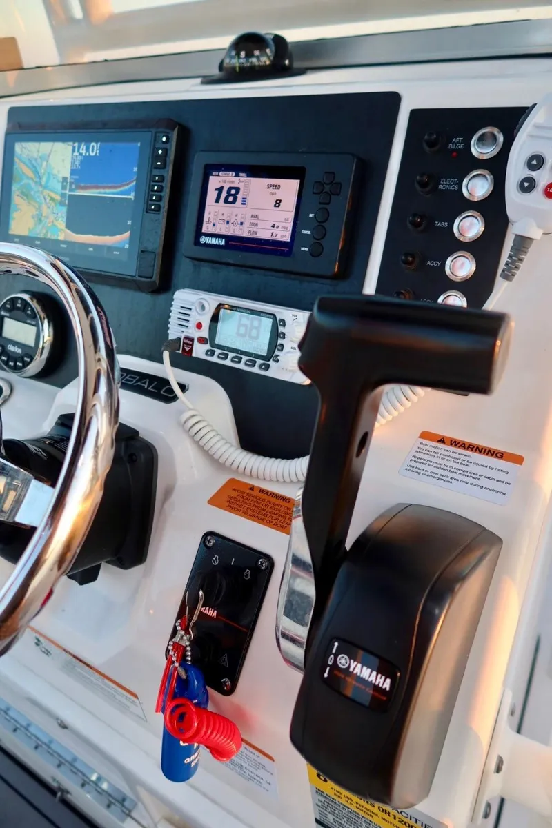 Slide: The Image of 2023 Robalo R200 Center Console dashboard with Yamaha controls and navigation displays. - 9