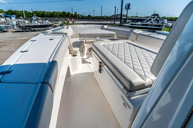 Slide: The Image of 2022 Blue Wave 2800 Makaira boat with spacious seating on calm water. - 20