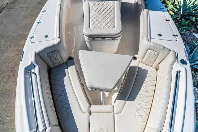 Slide: The Image of 2022 Blue Wave 2800 Makaira boat interior with open storage compartment. - 22