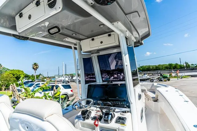 Slide: The Image of 2022 Blue Wave 2800 Makaira boat cockpit with modern controls and navigation systems. - 28
