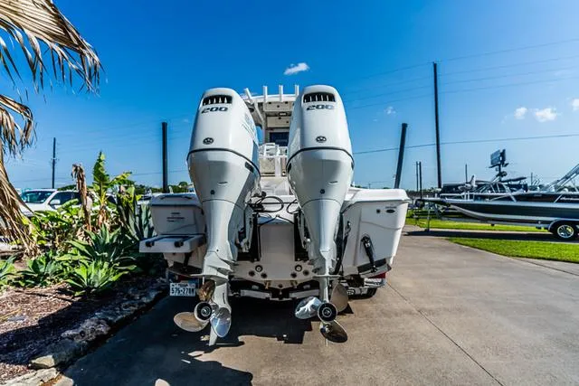 Slide: The Image of 2022 Blue Wave 2800 Makaira boat interior with overhead storage and LED light. - 3