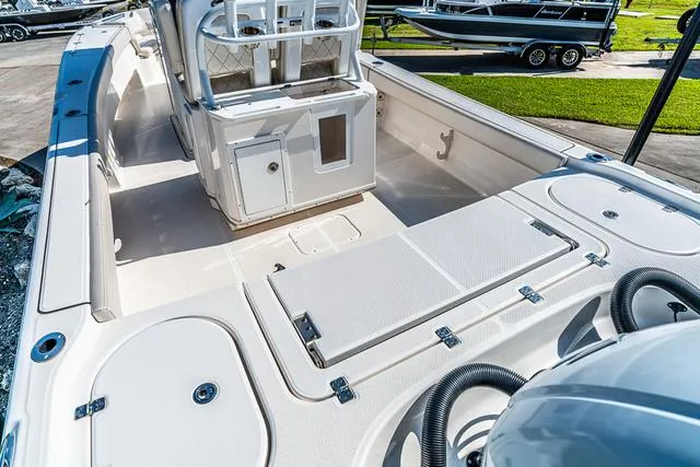 Slide: The Image of Close-up of 2022 Blue Wave 2800 Makaira boat detail with chrome button. - 5