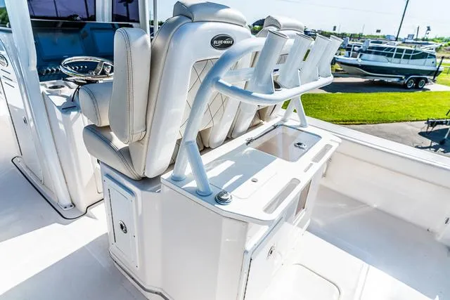 Slide: The Image of 2022 Blue Wave 2800 Makaira boat ladder over dark water. - 8