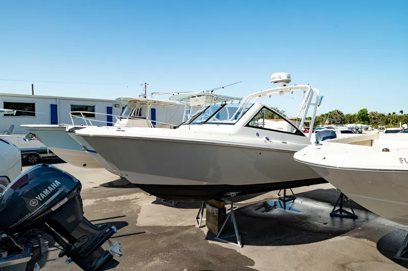 Slide: The Image of 2016 Everglades 230 Dual Console boat on display, featuring a Yamaha outboard motor. - 23