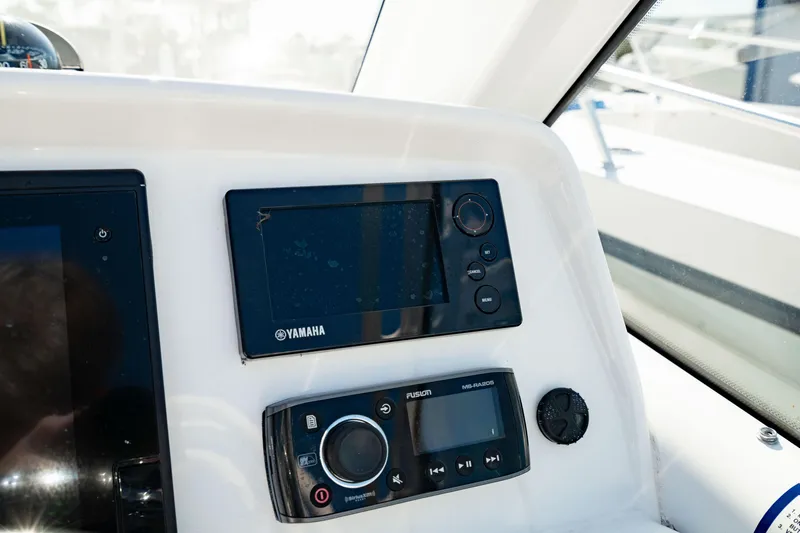 Slide: The Image of Control panel of 2016 Everglades 230 Dual Console boat with Yamaha display. - 25