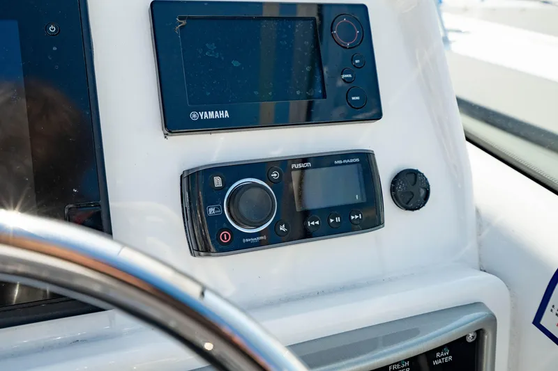Slide: The Image of Control panel of 2016 Everglades 230 Dual Console with Yamaha and Fusion electronics. - 26