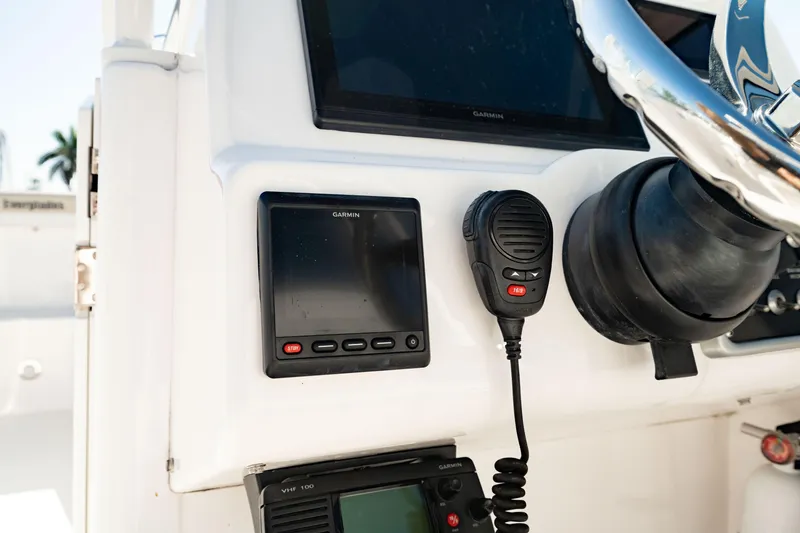 Slide: The Image of Control panel of 2016 Everglades 230 Dual Console boat with communication devices. - 28