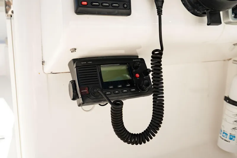 Slide: The Image of VHF radio on 2016 Everglades 230 Dual Console boat dashboard. - 29