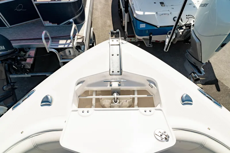 Slide: The Image of Bow view of 2016 Everglades 230 Dual Console boat, showcasing anchor storage. - 33