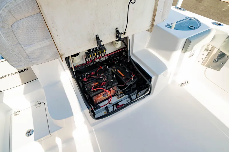 Slide: The Image of 2020 Sportsman Heritage 251 Center Console boat's open battery compartment. - 12