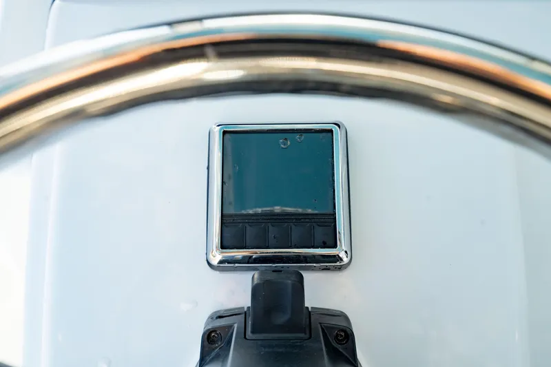 Slide: The Image of Steering wheel and display of 2020 Sportsman Heritage 251 Center Console boat. - 18