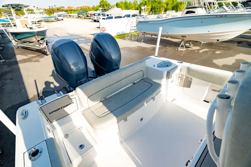 Slide: The Image of 2020 Sportsman Heritage 251 Center Console boat with dual engines and spacious seating area. - 2