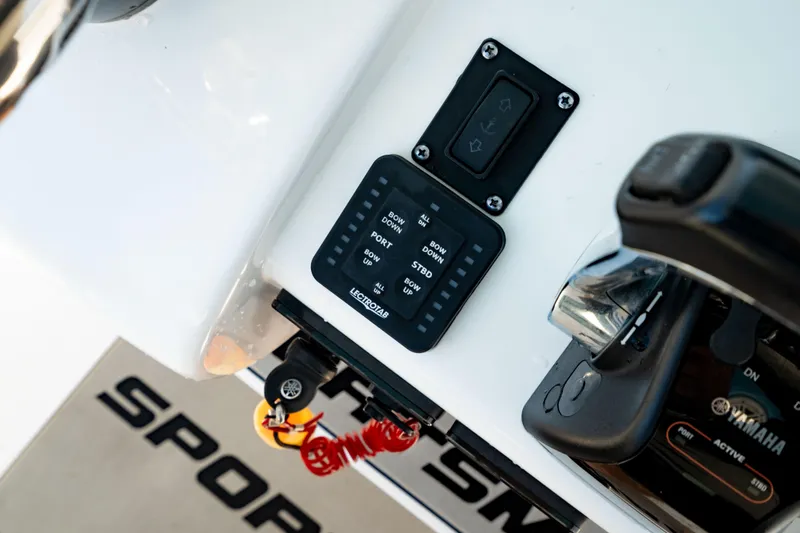 Slide: The Image of 2020 Sportsman Heritage 251 Center Console dashboard with controls and Yamaha throttle. - 20