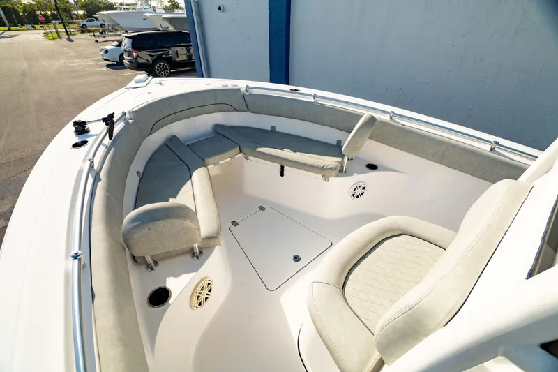 Slide: The Image of 2020 Sportsman Heritage 251 Center Console boat interior with cushioned seating and storage. - 30