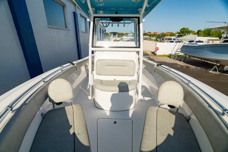 Slide: The Image of 2020 Sportsman Heritage 251 Center Console boat interior with seating and console view. - 31