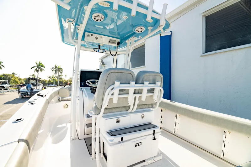 Slide: The Image of 2020 Sportsman Heritage 251 Center Console boat interior with seating and console. - 6